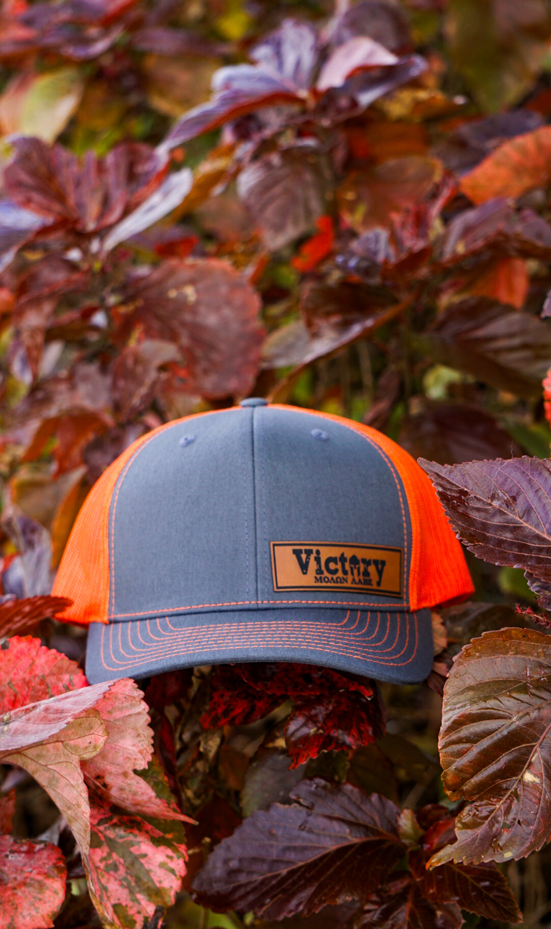 Richardson 112PM | GRY Hat ORG Mesh Trucker Victory Patch